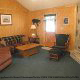 Pine furnished living room in Cabin 10, (Mountain Haven), in Pigeon Forge, Tennessee.