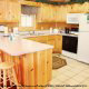Kitchen with bar in cabin 101 (Heavenly Hideaway) at Eagles Ridge Resort at Pigeon Forge, Tennessee.