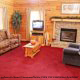 Living room with fireplace in cabin 101 (Heavenly Hideaway) at Eagles Ridge Resort at Pigeon Forge, Tennessee.