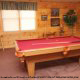 Game room with pool table in cabin 101 (Heavenly Hideaway) at Eagles Ridge Resort at Pigeon Forge, Tennessee.
