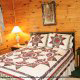 This country bedroom is full of charm in cabin 102 (Barbaras View), in Pigeon Forge, Tennessee. 