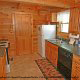Prepare any meal in this quaint kitchen in cabin 103 (Knotty Pine), in Pigeon Forge, Tennessee. 