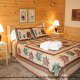 Country Bedroom View of Cabin 11 (Sweet Serenity) at Eagles Ridge Resort at Pigeon Forge, Tennessee.
