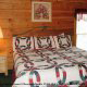 Warm country bedroom in Cabin 14, (The View), in Pigeon Forge, Tennessee.