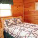 Country bedroom in Cabin 14, (The View), in Pigeon Forge, Tennessee.