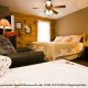 Country Bedroom with Jacuzzi in Cabin 15 (A Bears Life) at Eagles Ridge Resort at Pigeon Forge, Tennessee.