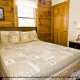 Country Bedroom with Night Stand - Cabin 15 (A Bears Life) at Eagles Ridge Resort at Pigeon Forge, Tennessee.