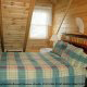 Another bedroom with a window in Cabin 2, (Close To Heaven), in Pigeon Forge, Tennessee.