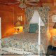 Country style bedroom in Cabin 2, (Close To Heaven), in Pigeon Forge, Tennessee.