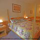 Bedroom with King Size Bed in Cabin 202 (Now And Forever) at Eagles Ridge Resort at Pigeon Forge, Tennessee.