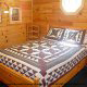 Country Bedroom View of Cabin 203 (Kevins Haven) at Eagles Ridge Resort at Pigeon Forge, Tennessee.