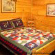 Bedroom with Full Size Bed in Cabin 203 (Kevins Haven) at Eagles Ridge Resort at Pigeon Forge, Tennessee.