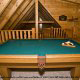 Game Room View with Pool Table of Cabin 205 (Love Nest) at Eagles Ridge Resort at Pigeon Forge, Tennessee.