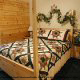 Country bedroom in cabin 209 (Montgomery\'s Hideaway), in Pigeon Forge, Tennessee. 