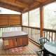 Large deck with hot tub in cabin 209 (Montgomery\'s Hideaway), in Pigeon Forge, Tennessee. 