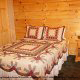 Country Bedroom View of Cabin 212 (Codys Comfort) at Eagles Ridge Resort at Pigeon Forge, Tennessee.