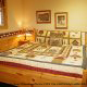 Country bedroom in cabin 213 (Treasured Times), in Pigeon Forge, Tennessee.