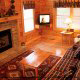 Cozy country living room in cabin 213 (Treasured Times), in Pigeon Forge, Tennessee.