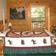 Bedroom View with King Size Bed in Cabin 214 (A Birds Nest) at Eagles Ridge Resort at Pigeon Forge, Tennessee.