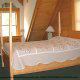 Bedroom with two Night Stands in Cabin 214 (Birds Nest) at Eagles Ridge Resort at Pigeon Forge, Tennessee.