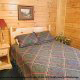 Country Bedroom View of Cabin 215 (Red Bird Haven) at Eagles Ridge Resort at Pigeon Forge, Tennessee.