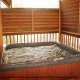 Hot tub on porch in cabin 216 (Bearly County), in Pigeon Forge, Tennessee.