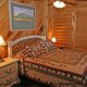 Country Bedroom View of Cabin 22 (Beaver Lodge) at Eagles Ridge Resort at Pigeon Forge, Tennessee.