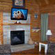 Living Room View with Fire Place in Cabin 22 (Beaver Lodge) at Eagles Ridge Resort at Pigeon Forge, Tennessee.