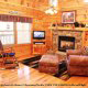 Great room with fireplace to relax in cabin 220 (Mountain Hideaway), in Pigeon Forge, Tennessee. 