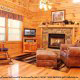 Living room with fire place in cabin 220 (Mountain Hideaway), in Pigeon Forge, Tennessee. 
