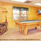 Game room with pool table in cabin 220 (Mountain Hideaway), in Pigeon Forge, Tennessee. 