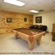 Game room with pool table in cabin 222 (Robins Nest), in Pigeon Forge, Tennessee. 