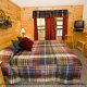 Country Bedroom View of Cabin 223 (Youngs Hideaway) at Eagles Ridge Resort at Pigeon Forge, Tennessee.