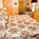Bedroom with Day Bed in Cabin 223 (Youngs Hideaway) at Eagles Ridge Resort at Pigeon Forge, Tennessee.