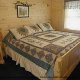 Bedroom with king Size Bed in Cabin 225 (Vivs View) at Eagles Ridge Resort at Pigeon Forge, Tennessee.