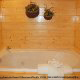 Bathroom View with Jacuzzi of Cabin 228 (Lockers Lodge) at Eagles Ridge Resort at Pigeon Forge, Tennessee.