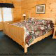 Country Bedroom View of Cabin 229 (Brief Escape) at Eagles Ridge Resort at Pigeon Forge, Tennessee.