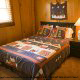 Country Bedroom View of Cabin 23 (Smoky Memories) at Eagles Ridge Resort at Pigeon Forge, Tennessee.