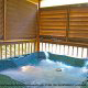 Porch View with Hot Tub of Cabin 232 (Mountain Spirits) at Eagles Ridge Resort at Pigeon Forge, Tennessee.
