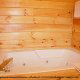 Bathroom View with Jacuzzi of Cabin 232 (Mountain Spirits) at Eagles Ridge Resort at Pigeon Forge, Tennessee.