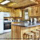 Large kitchen with bar in cabin 233 (Bear Creek Lodge) at Eagles Ridge Resort at Pigeon Forge, Tennessee.
