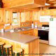 Large kitchen with bar in cabin 234 (Dancing Bear Lodge) at Eagles Ridge Resort at Pigeon Forge, Tennessee.