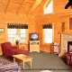 Living room with vaulted ceiling and fireplace in cabin 234 (Dancing Bear Lodge) at Eagles Ridge Resort at Pigeon Forge, Tennessee.