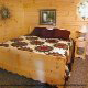 Country bedroom in cabin 239 (Sleepy Bear) , in Pigeon Forge, Tennessee. 
