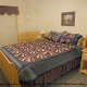 Country bedroom in cabin 240 (Smoky Safari ) , in Pigeon Forge, Tennessee.