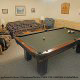Game room with pool table in cabin 240 (Smoky Safari ) , in Pigeon Forge, Tennessee.