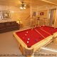 Game room with pool table in cabin 244 (Blackhawk Hideaway) , in Pigeon Forge, Tennessee.