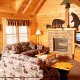 Living room with vaulted ceilings and fire place in cabin 246 (The Getaway) , in Pigeon Forge, Tennessee.