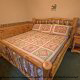 Bedroom with King Size Bed in Cabin 249 (Taylors Treasure) at Eagles Ridge Resort at Pigeon Forge, Tennessee.