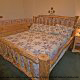 Bedroom with Night Stand in Cabin 249 (Taylors Treasure) at Eagles Ridge Resort at Pigeon Forge, Tennessee.